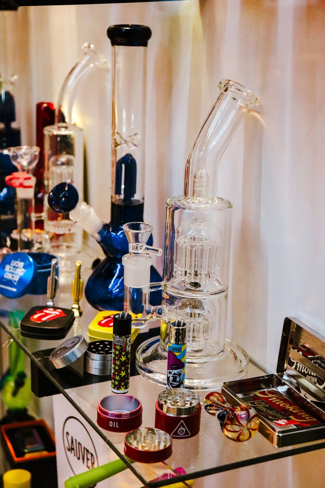 Variety of glass pipes and smoking accessories displayed at a Tulsa tobacco shop.