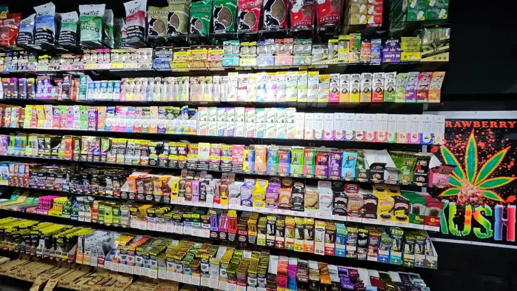 Full wall of diverse tobacco, vape, and kratom products on display at a premier kratom retail Tulsa location.