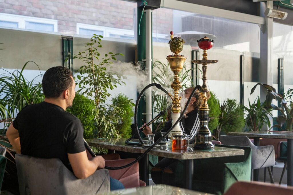 Sign showing rules with a person holding a hose; essential etiquette for any Shisha Store in Tulsa