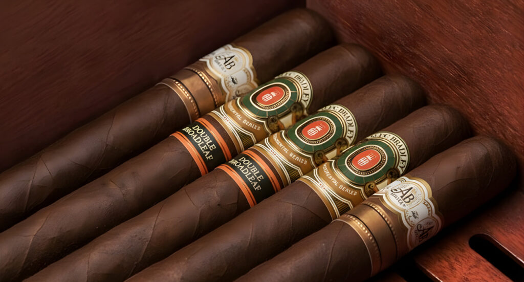 A box of Alec Bradley Double Broadleaf cigars at a cigar shop Tulsa, showing the dark leaves and secondary bands.