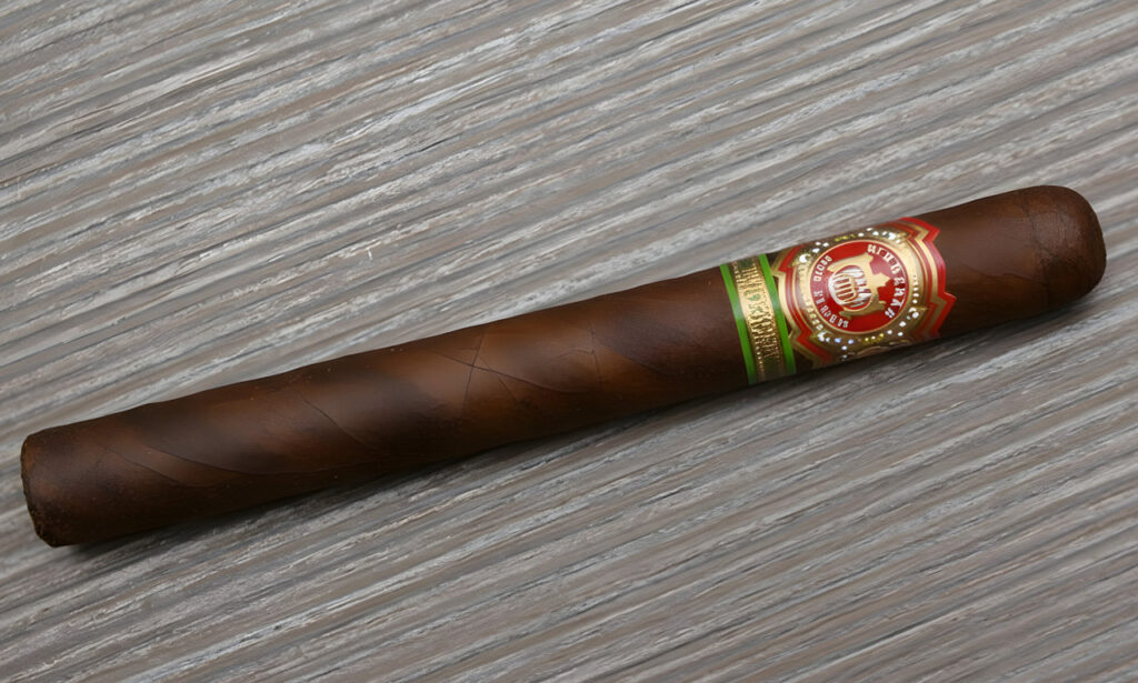 Premium dark maduro specialty blend cigar from a cigar shop Tulsa, featuring a rich brown wrapper and red band.