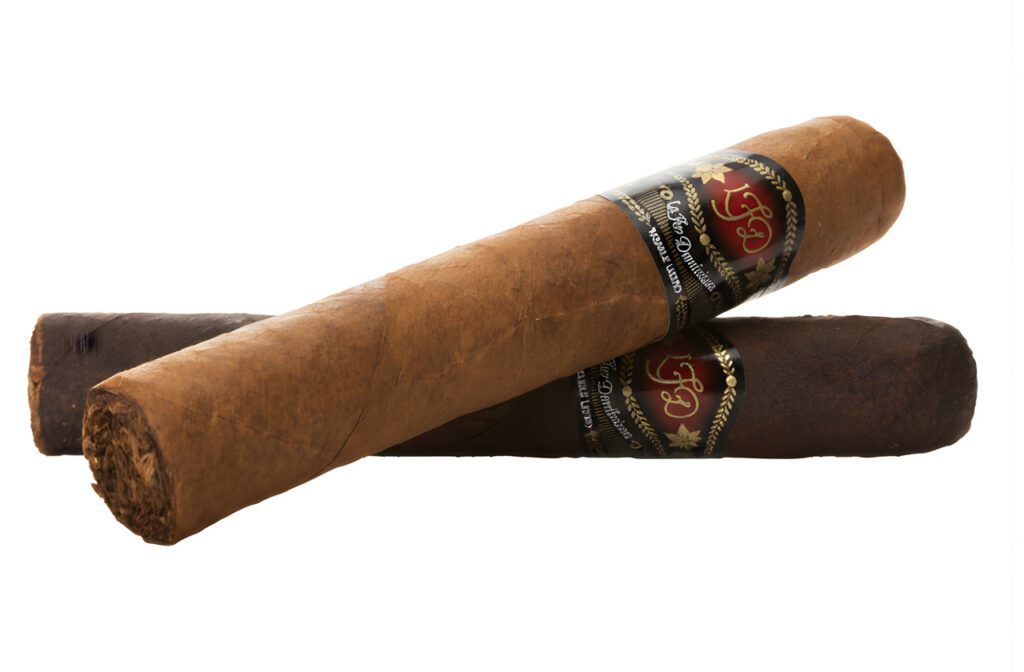 Two premium hand-rolled La Flor Dominicana cigars available at a luxury cigar store Tulsa for local aficionados.