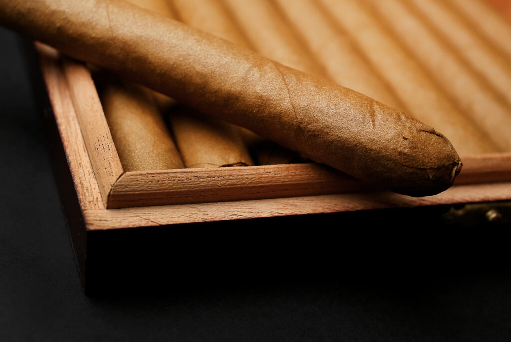 Hand-rolled luxury cigars in a wooden box, a premium selection available at a top-rated cigar store Tulsa Oklahoma.