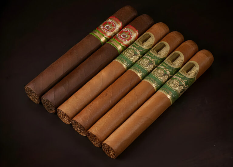 A diverse lineup of premium hand-rolled cigars at a cigar shop Tulsa, showing various shade and maduro and connecticut.