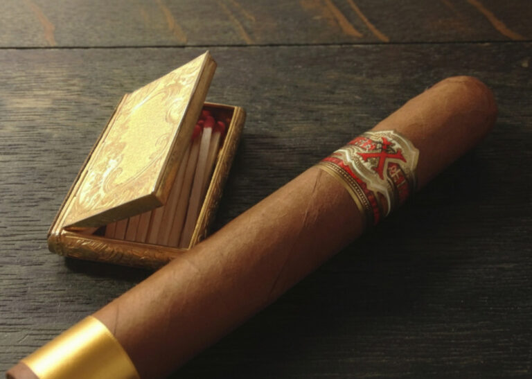 Premium Fuente Fuente Opus X cigar with gold matches, exclusive rare finds at a high-end cigar store Tulsa shop.