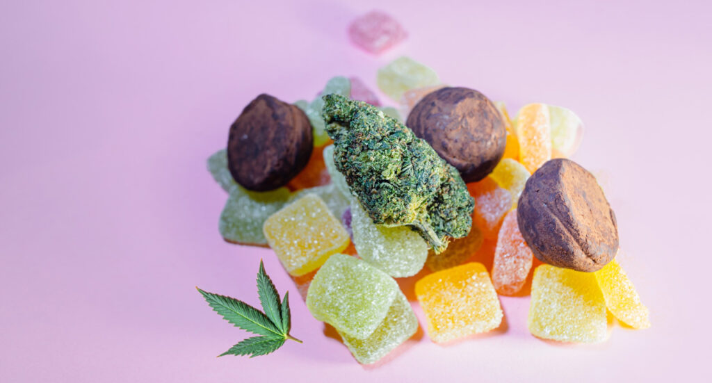 A colorful counter display of high-quality CBD flower and packaged edibles inside the top-rated cbd store tulsa.