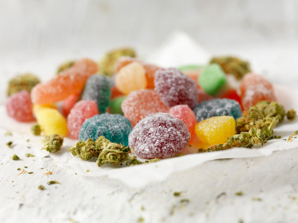 Brightly lit display of colorful CBD edibles and flower, the best selection at your local cbd shop tulsa.