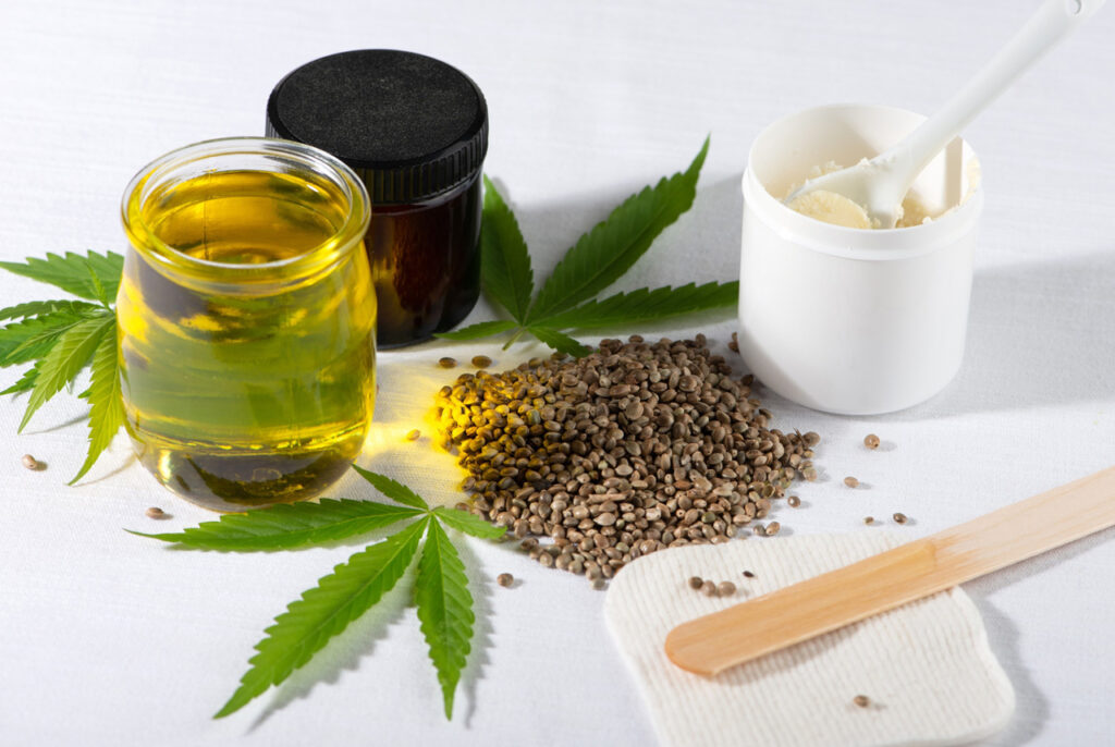 Hemp seeds and topical creams at a cbd store tulsa featuring organic cannabis leaves and natural wellness oils.