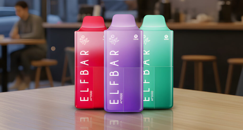 Trio of colorful Elf Bar disposable vapes Tulsa on a wooden table, showcasing sleek design and vibrant flavors.