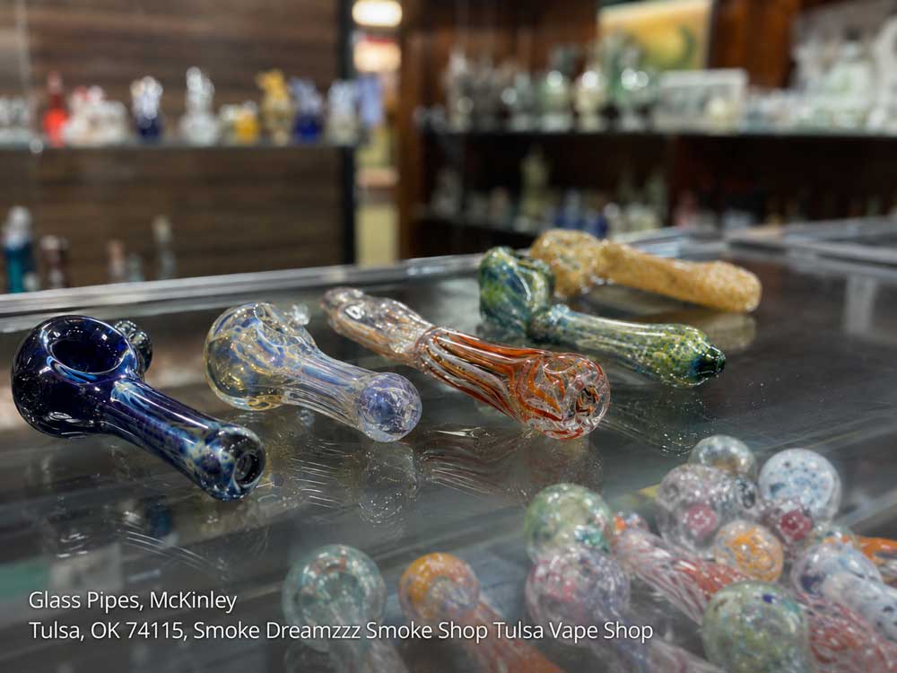 Handcrafted glass pipes Tulsa on display at Smoke Dreamzzz Smoke Shop in McKinley, featuring vibrant colors.