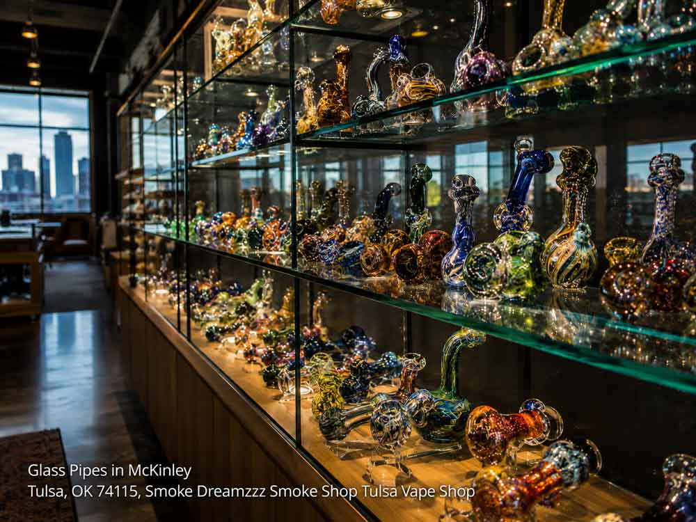 Shelves packed with unique glass pipes Tulsa at Smoke Dreamzzz Smoke Shop, offering a massive selection.